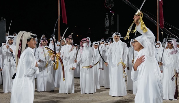 His Highness the Amir Sheikh Tamim bin Hamad Al-Thani participates Friday in Qatar's Ardah (traditional sword dance), held in Amiri Diwan Yard on the Corniche, to celebrate Qatar National Day
