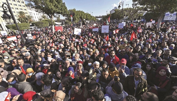 Supporters of the u2018Citizens Against Coupu2019 campaign demonstrate against President Kais Saied  yesterday in Tunis, on the 11th  anniversary of the start of the 2011 revolution.