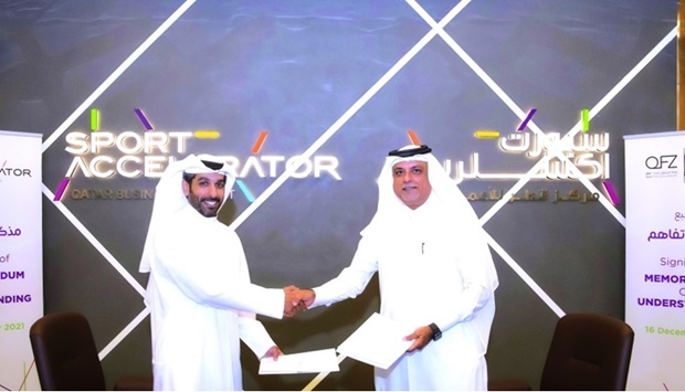 The Sport Accelerator president Ali Abdullah al-Mutawa and QFZA chief corporate support officer and acting chief zones operating officer Fahad Zainal shaking hands after signing the MoU.