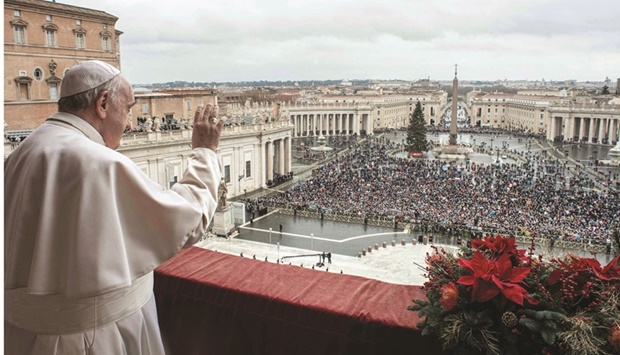 Pope Francis waving to the followers in St Peteru2019s Square at The Vatican yesterday. (AFP)