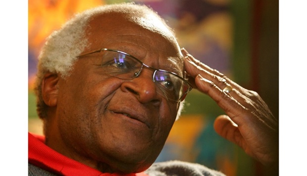 Archbishop Desmond Tutu ponders a point during an interview at his office in Cape Town, South Africa, April 25, 2006. REUTERS