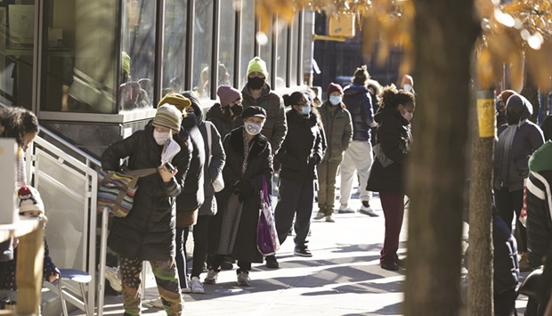 A line outside a New York City Health and Hospitals Covid-19 testing site in the Lower East Side neighbourhood of New York. The surge in Covid cases linked to the Omicron variant adds another complication for managers of existing US collateralised loan obligations that have some discretion over when they start using SOFR as a benchmark for their liabilities.