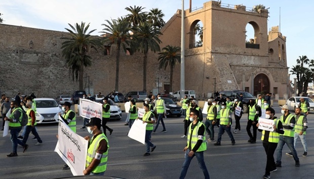 A group of young Libyan activists protest against the postponement of the presidential elections in the capital Tripoli's Martyrs Square, on December 25,2021. AFP