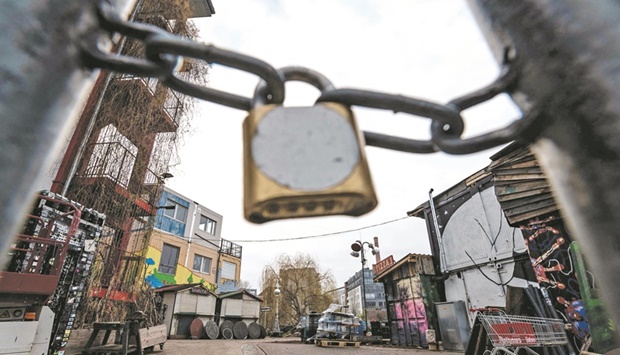 A locked gate blocks access to the Berlinu2019s Holzmarkt 25 area  yesterday. In response to the growing occurrence of the Covid-19 Omicron variant in Germany, the federal government has put a lid on New Year celebrations.