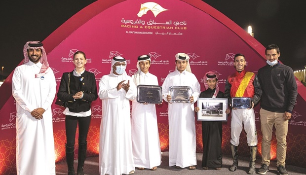 QREC Racing Manager Abdulla Rashid al-Kubaisi (third left) poses with the connections of Mater, which won the Bu Samrah Cup yesterday.