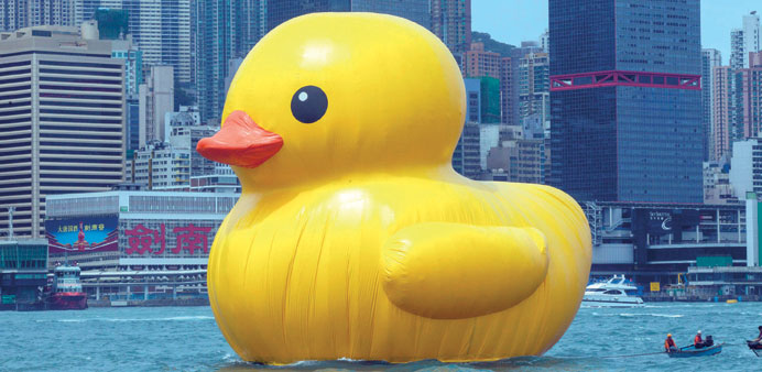 Dutch conceptual artist Florentijn Hofmanu2019s u2018Rubber Ducku2019 floats across Hong Kongu2019s Victoria Harbour yesterday.