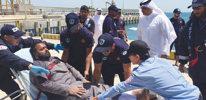  A rescued fisherman being administered medical aid on Thursday morning. 