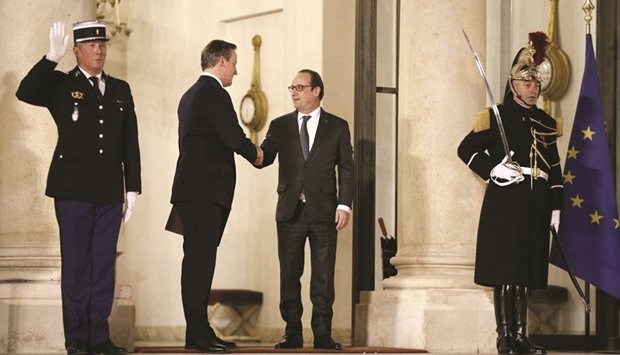 French President Francois Hollande with British prime minister David Cameron after their meeting at the Elysee Palace yesterday in Paris.