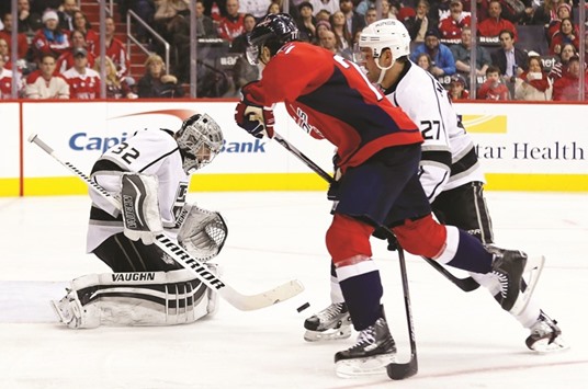 Los Angeles Kings goalie Jonathan Quick makes a save on Washington Capitals right wing T.J. Oshie (C) in the third period at Verizon Center. The Capitals won 3-1. PICTURE: USA TODAY Sports