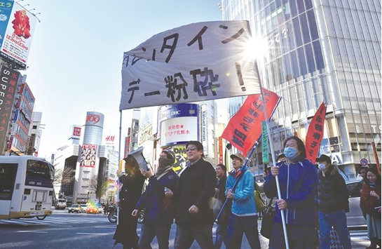 Japanese protesters stage an anti-Valentineu2019s Day demonstration march in Tokyo yesterday.