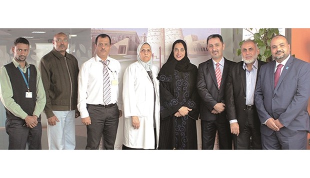 Dr Huda al-Naemi along with HMC staff working on the project.