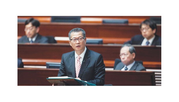 Hong Kongu2019s financial secretary Paul Chan delivers the 2017 budget speech at the Legislative Council yesterday. Chan said that an improved labour market and construction projects worth nearly HK$87bn this year, had also bolstered consumer confidence that would feed into the local economy.