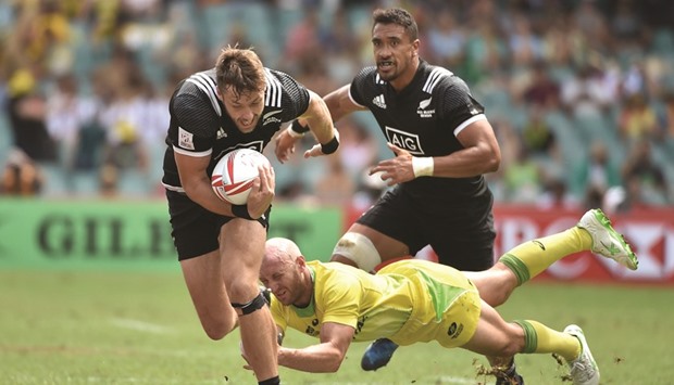 Tim Mikkelson of New Zealand (L) in action yesterday.