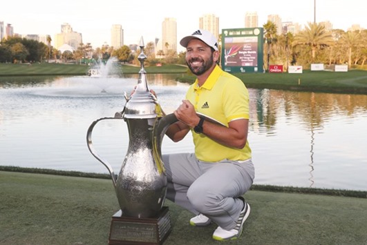 Sergio Garcia of Spain poses with the trophy following the final round of the Omega Dubai Desert Classic at the Emirates Golf Club in Dubai yesterday. (AFP)