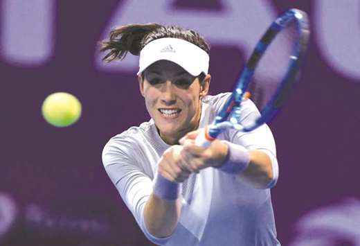 Spainu2019s Gabrine Muguruza in action against Petra Kvitova of Czech Republic during their Qatar Total Open final at Khalifa International Tennis and Squash Complex on Sunday. (Reuters)