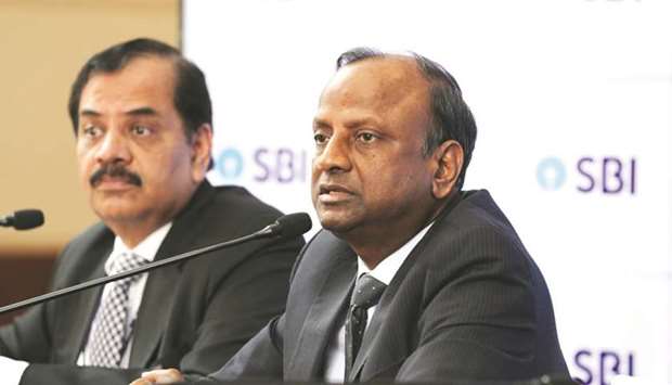 SBI chairman Rajnish Kumar (right) during the launch of the Global NRI Centre in Kochi, Kerala recently.