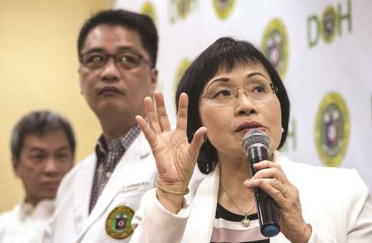 Juliet Sio-Aguilar (right), paediatrician and head of the Philippine General Hospital (PGH) expert panel, speaks during a press conference regarding the Dengvaxia vaccine at the DoH headquarters in Manila.