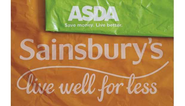 Shopping bags from Asda and Sainsburyu2019s are seen in Manchester. Britainu2019s competition regulator has dealt a potentially fatal blow to Sainsburyu2019s planned $9.5bn takeover of Walmartu2019s Asda, saying the supermarket groups are unlikely to be able to address its u201cextensiveu201d concerns about the deal.