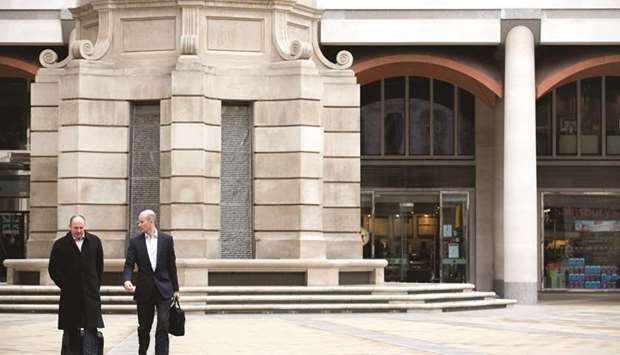 Pedestrians walk across Paternoster Square in front of the London Stock Exchange Group headquarters. The FTSE 100 closed 0.7% up at 7,020.22 points yesterday.