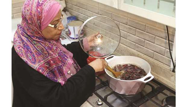 Moudi al-Miftah, a 64-year-old journalist, cooks locust at her home in Al-Ahmadi, some 35km south of Kuwait City, on January 25.