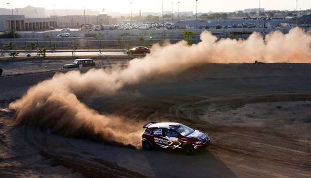 Qatari Nasser al-Attiyah and co-driver Matthieu Baumel compete during the super special stage in the Oman International Rally in Muscat. The Oman rally is the first of five rounds in this season's series and part of the FIA Middle East Rally Championship.