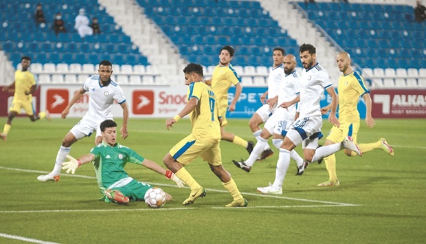 Al Gharafau2019s Ahmed al-Ganehi attempts to score past Al Khor goalkeeper Ali Nader Mahmoud during the QNB Stars League match at the Al Bayt Stadium on Thursday. PICTURE: Ram Chand