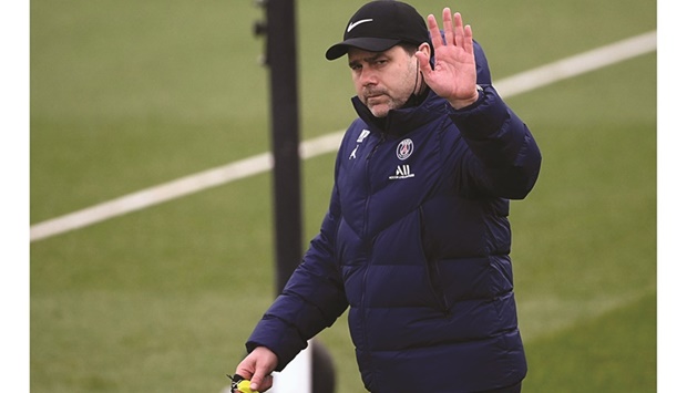 Paris Saint-Germainu2019s Argentinian head coach Mauricio Pochettino waves as he arrives for a training session at the Camp des Loges in Saint-Germain-en-Laye, west of Paris, yesterday. (AFP)