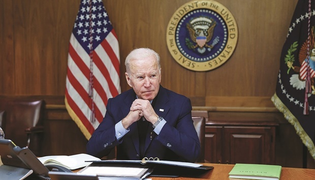 US President Joe Biden speaks on the phone with Russian counterpart Vladimir Putin about a possible Russian invasion of Ukraine, as he spends the weekend at the US presidential retreat at Camp David, in this official photo released after the call took place in Thurmont, Maryland, yesterday. (Reuters)