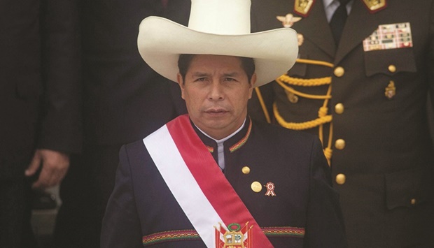 In this file photo taken on July 28, 2021 Peruvian President Pedro Castillo wears the presidential sash as he exits the Congress after his inauguration ceremony in Lima. (AFP)