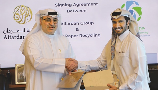 Omar Hussain Alfardan and Abdulla Ibrahim al-Sowaidi at the agreement signing.