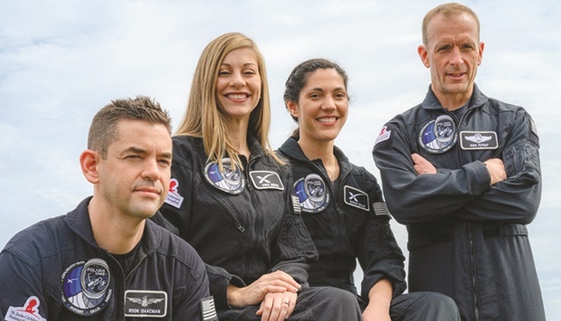 An undated photo shows the SpaceX Polaris Dawn crew. (L to R): Jared Isaacman, Mission Commander, Anna Menon, Mission Specialist and Medical Officer, Sarah Gillis, Mission Specialist, and Scott Poteet, Mission pilot. (AFP)