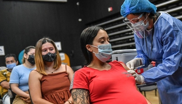 A pregnant woman being inoculated with the Pfizer-BioNTech vaccine against Covid-19 at a vaccination center in Medellin, Colombia. AFP file photo July 24, 2021