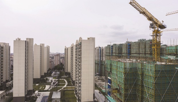 Unfinished apartment buildings at the Phoenix City residential project, developed by Country Garden Holdings Co, in Shanghai. Almost exactly a year after Chinau2019s property-market debt squeeze sparked the first in a wave of defaults by developers, the industry is fighting for survival.