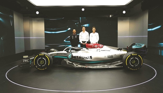 Mercedes drivers Lewis Hamilton (left) and George Russell posing alongside Mercedes chief Toto Wolff (centre) with the new Mercedes-AMG F1 W13 in Silverstone yesterday. (AFP)