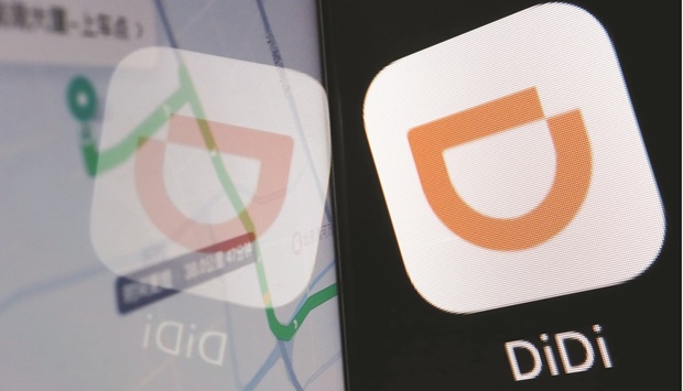 The app logo of Chinese ride-hailing giant Didi is seen reflected on its navigation map displayed on a mobile phone in this illustration picture taken on July 1, 2021. What once seemed an unstoppable ascent of Chinau2019s Big Tech started to crumble a year ago, as Beijingu2019s crackdown in pursuit of u201ccommon prosperityu201d upended the fortunes of the likes of Didi Global Inc and Alibaba Group Holding Ltd.