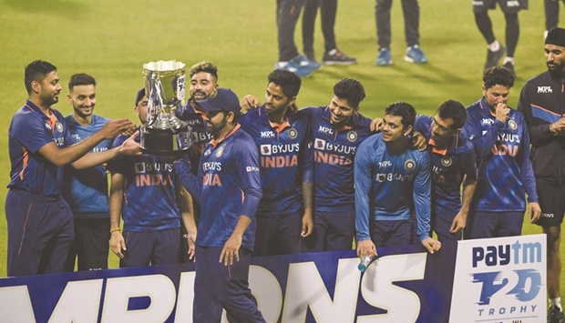 Indiau2019s players celebrate with the trophy after winning the third and final international Twenty20I against West Indies at the Eden Gardens in Kolkata yesterday. (AFP)