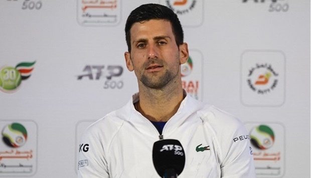 A handout picture made available by the press office of the Dubai Duty Free Tennis Championship on February 20, 2022 shows Serbian Tennis player Novak Djokovic holding a press conference ahead of the ATP Dubai Duty Free Tennis Championship in the Gulf emirate of Dubai.