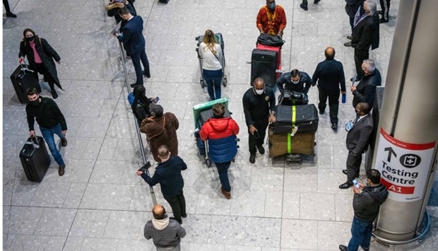 Passengers in the arrivals hall, following the end of the requirement for vaccinated travellers to take a Covid-19 test after arriving in England, at London Heathrow Airport. In a sign that momentum towards normalising air traffic is growing, the European Union countries recently agreed to open their borders to travellers from outside the bloc who have had shots against Covid-19 authorised by the World Health Organisation.