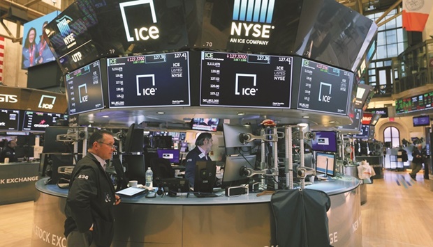 Traders work on the floor of the New York Stock Exchange (file). US stocks are drawing buyers after a recent tumble, but some investors believe buying the dip this time may be a far riskier bet than in the past.