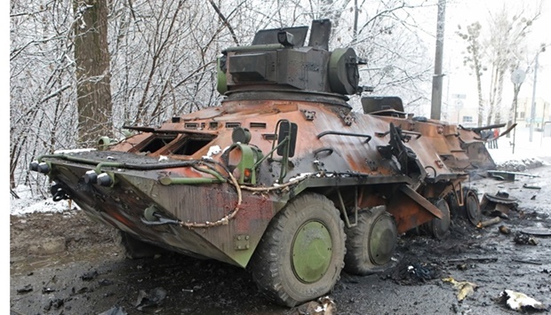 A view shows a destroyed armored personnel carrier (APC) on the roadside in Kharkiv, Ukraine. REUTERS/Vyacheslav Madiyevskyy