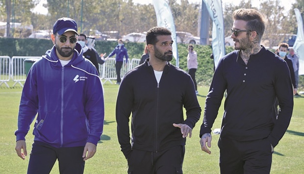 Football icon David Beckham (right) with Secretary-General at Supreme Committee for Delivery & Legacy Hassan al-Thawadi and Generation Amazing Programmes Director Nasser al-Khori (left) during the opening of the Generation Amazing Community Club on Qatar National Sport Day in Lusail.