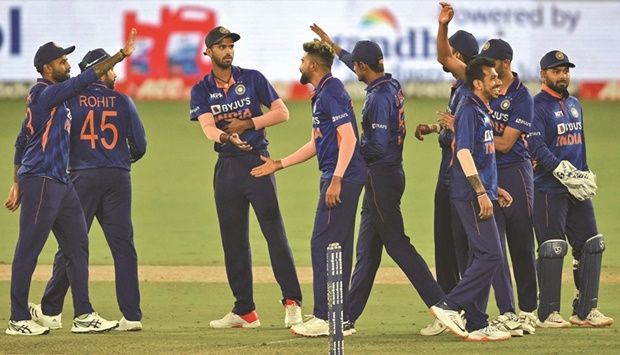 Indian players celebrate after the dismissal of West Indiesu2019 Fabian Allen (not pictured) during the second One-Day International (ODI) in Motera, Ahmedabad, yesterday. (AFP)