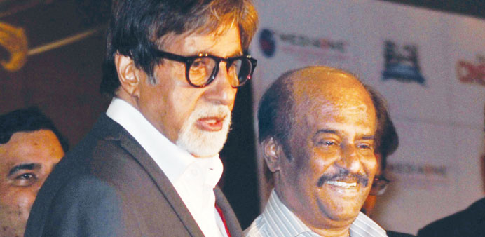 Superstars Amitabh Bachchan and Rajnikanth speak to fans during a promotional event for the film Kochadaiiyaan in Mumbai late Sunday.