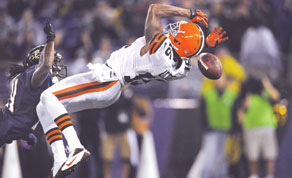 Ravens beat winless Browns; Real refs return