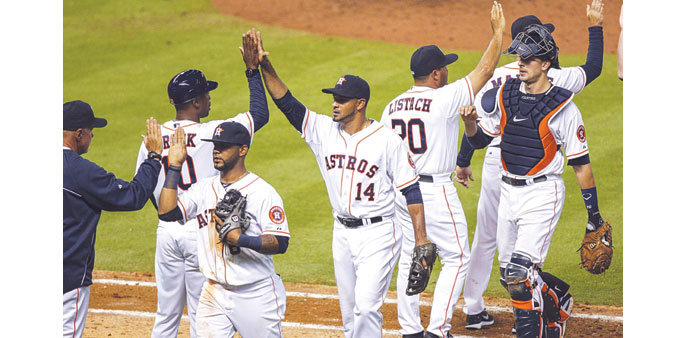 Houston Astros' L.J. Hoes, right, celebrates after his solo home