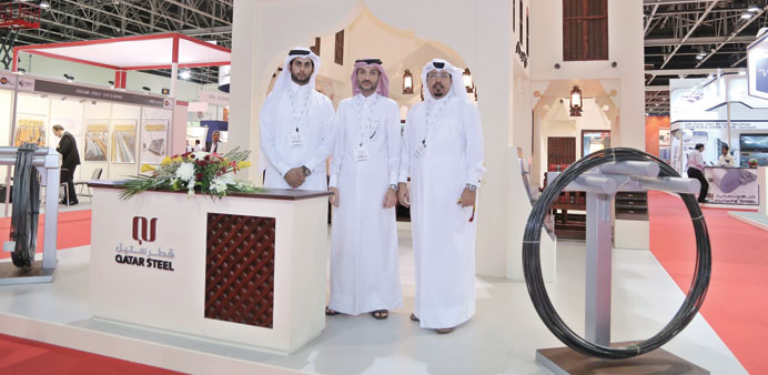 Officials at the Qatar Steel stand.