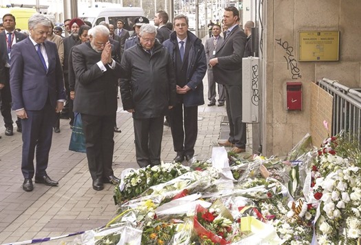 Prime Minister Narendra Modi pays tribute to the victims of the Brussels terror attack at a street memorial outside Maelbeek metro station yesterday.