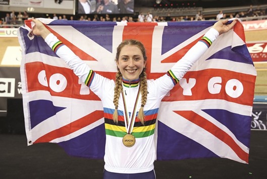 Laura Trott of Britain celebrates on the podium.