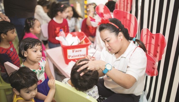 Children queue up to enjoy face painting during Ikea anniversary celebrations at its Qatar store.