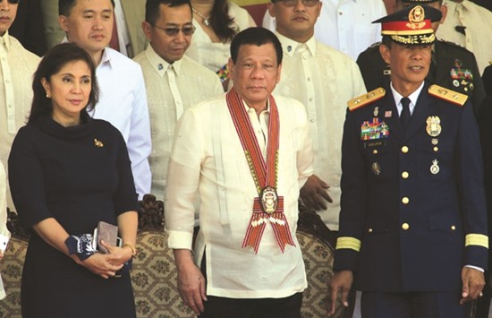 President Rodrigo Duterte with Vice-President Leni Robredo attend the Philippine National Police Academy (PNPA) graduation ceremony in Camp Castaneda, Silang town in Cavite city, south of Manila.